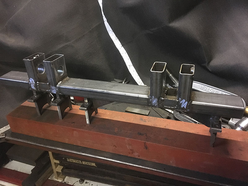 Rear axle lower linkage bracket assembly